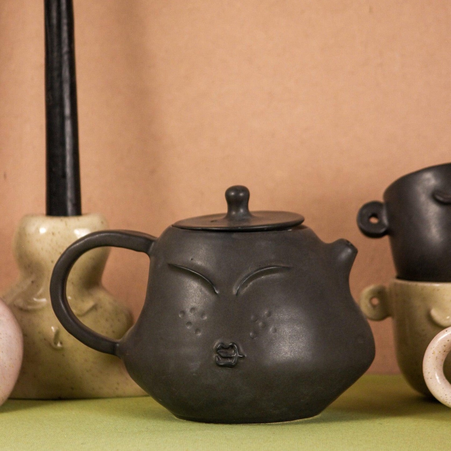 The Sage Face Black Ceramic Tea-Pot Set with 4 Cups