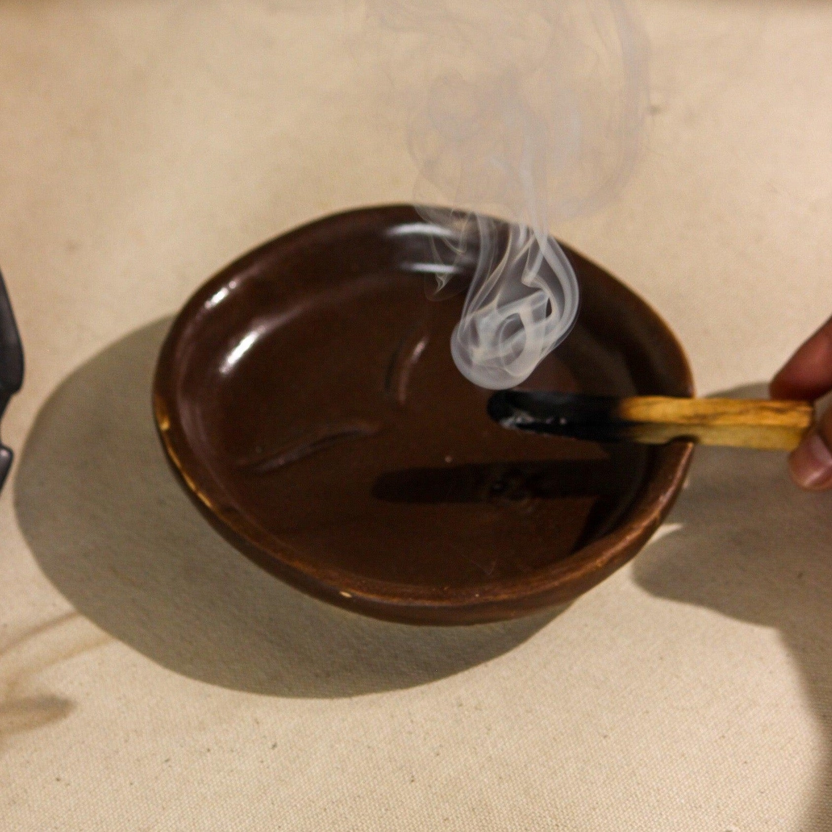 The Sage Face Ceramic Ash Tray in Black and Brown colour